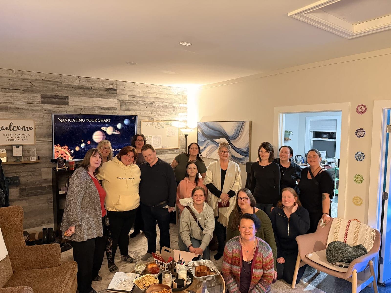 A group gathered in the studio for an evening event