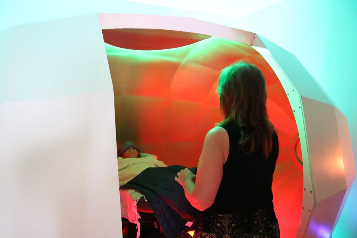 Sandra Mattice settling a client into the Harmonic Egg